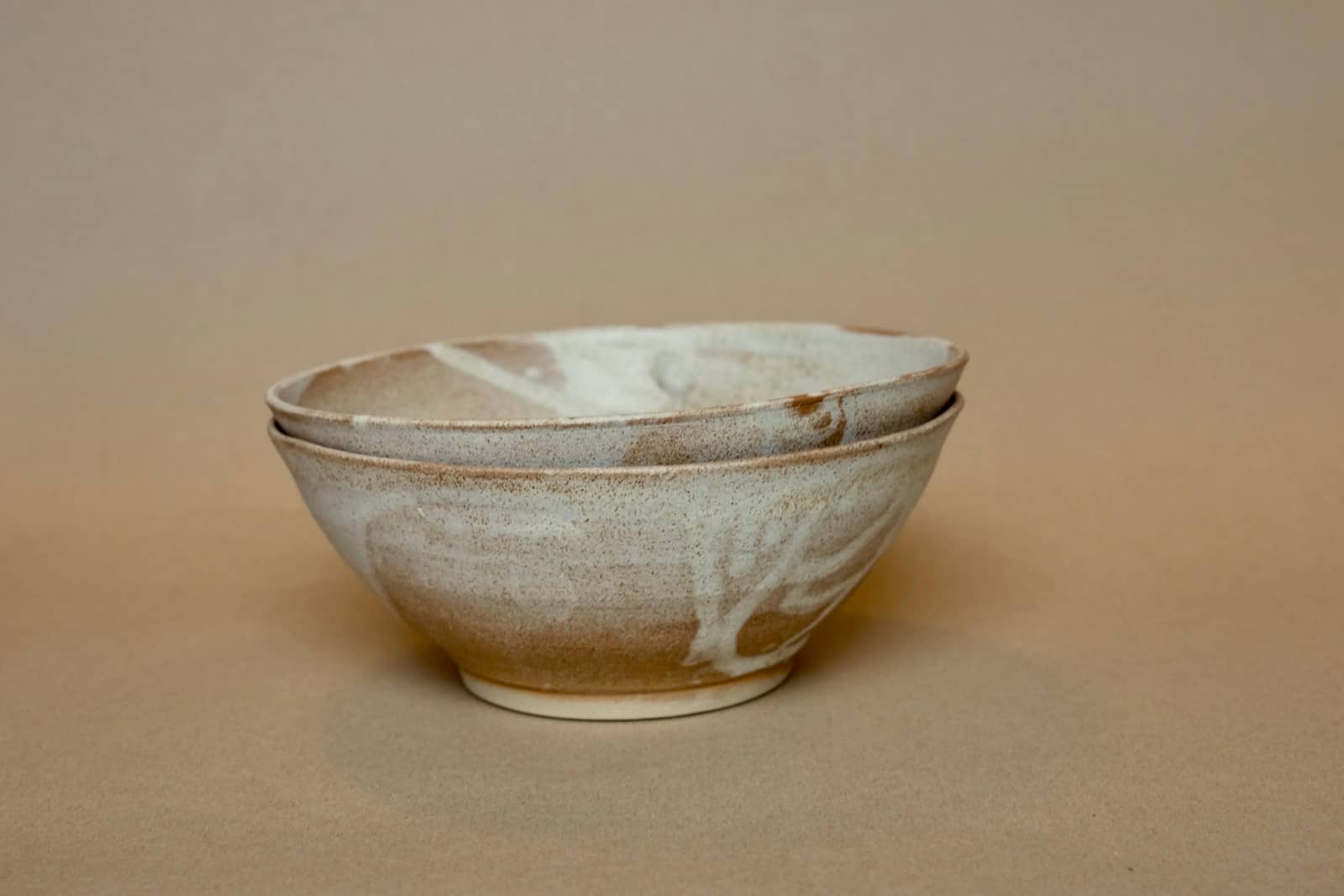 Companion bowls with unique individual glazing patterns.