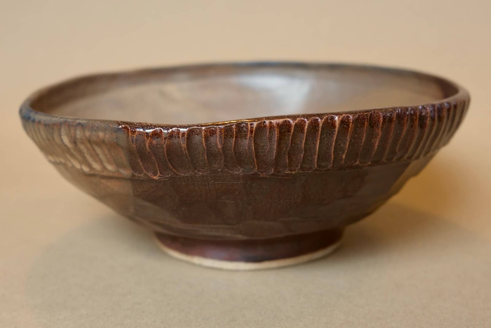 Sculptural centerpiece bowl with blue-grey accents.